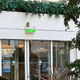The owl perched atop an exit sign